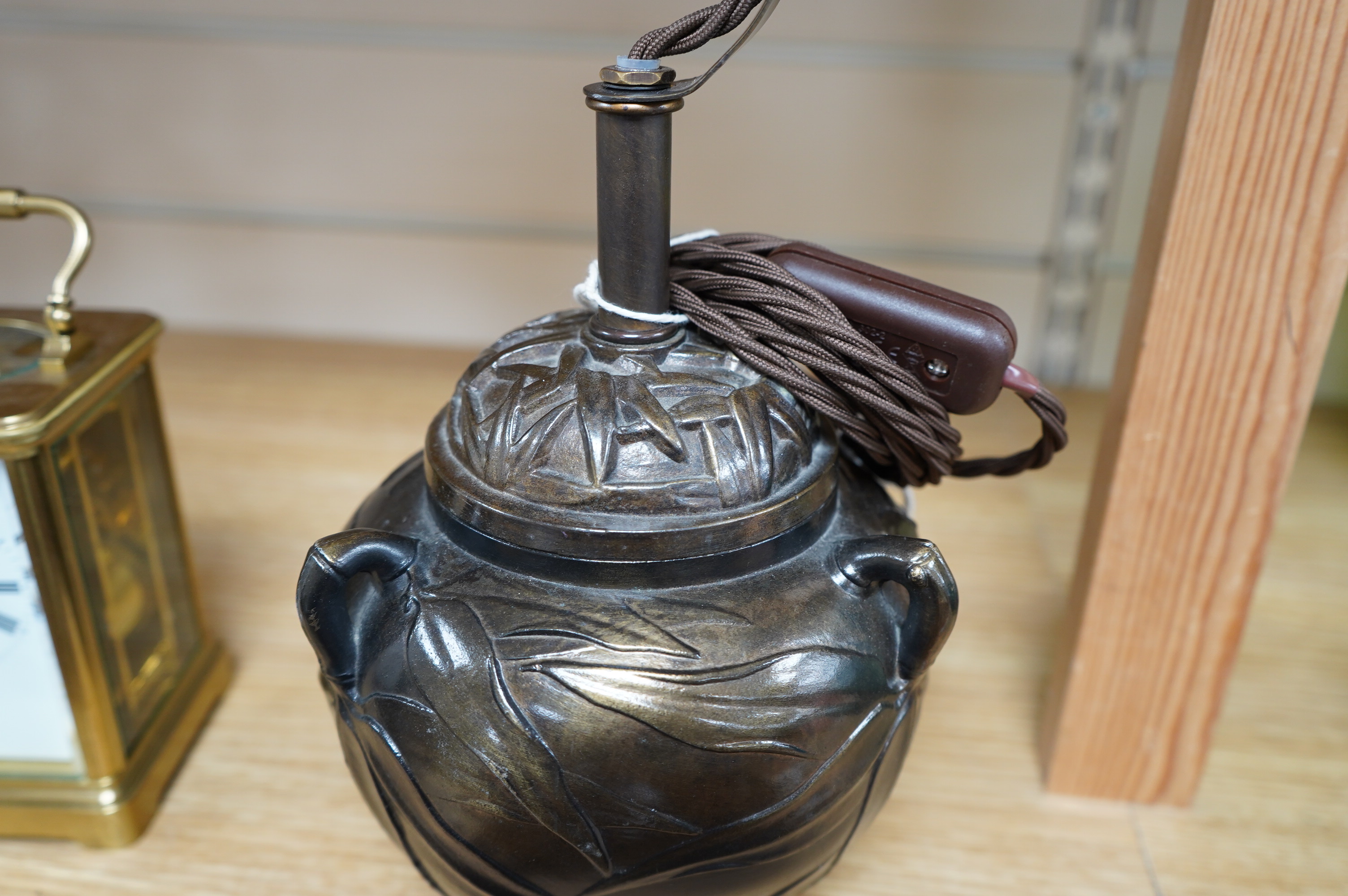 A Japanese bronze table lamp with white with green edge shade, wired, overall 33cm high, Condition - minor scuffing to the lacquer finish, in good condition, not tested